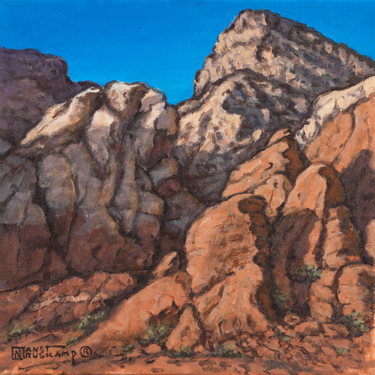 Red Rock Canyon #4, a landscape painting by world famous artist Janet Kruskamp. Red sandstone is topped by a lighter colored layer at the top of the canyon wall, forming into a peak. Small patches of green cling to the cracks in the canyon wall, spreading out t slightly at the canyon floor. An azure blue sky contrasts with the earthy tones of the canyon wall. One of the Interiors and Exteriors Gallery by Janet Kruskamp.