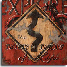 Explore, a new original painting from artist Janet Kruskamp, prominently features a classic winding road yellow diamond road sign on a red background, all painted onto wooden planks. Peeking out from behind the sign is a red classic Indian Motorcycle barely identifiable with just either end of the bike sticking from behind the top half of the sign. The motto EXPLORE the TWISTS and TURNS of Life is painted across the top and in front of the sign. One of a series of posters of vintage road signs from Janet Kruskamp. 